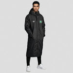 model wearing 1874 Northwich JFC Touchline Coat