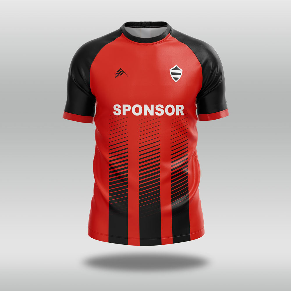 Red and black football shirt with a sponsor logo on a gray background