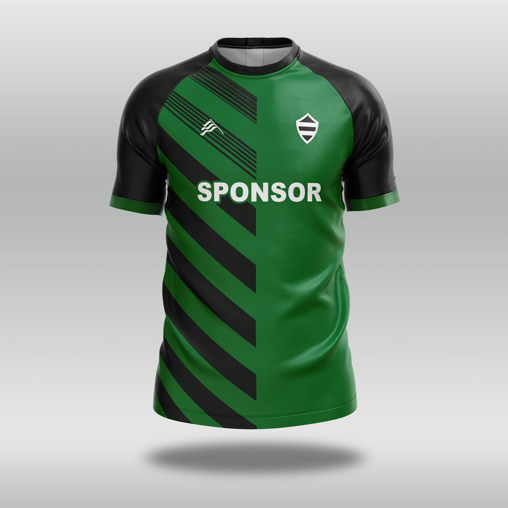 Green and black football shirt with a sponsor logo on a gray background