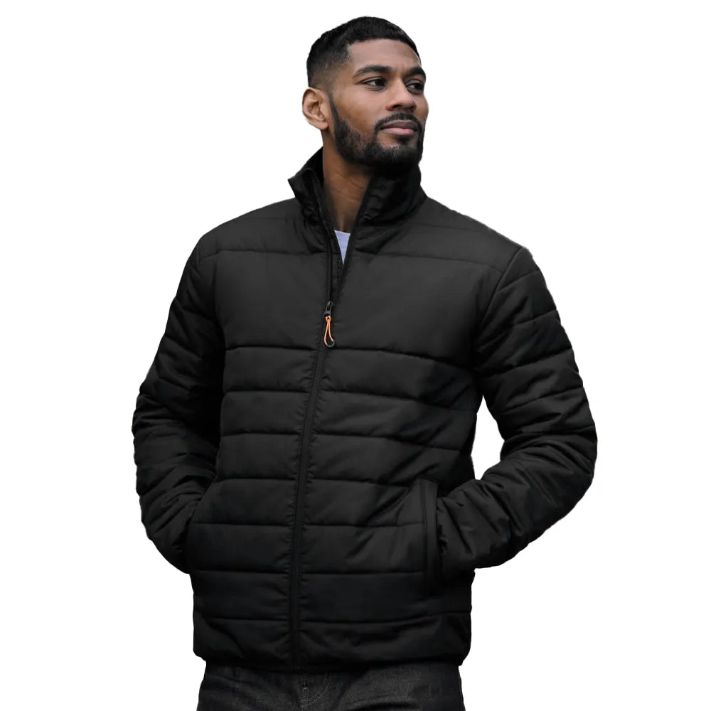 Man wearing a black Regatta puffer jacket on a white background