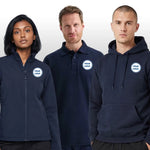 Three people wearing navy shirts and jackets with customizable logos on a gray background
