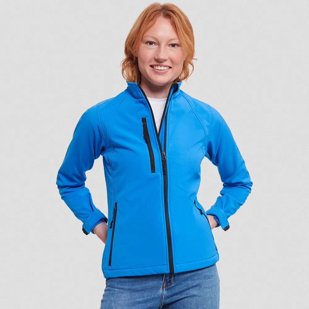 A model wearing a Russell Ladies Soft Shell Jacket