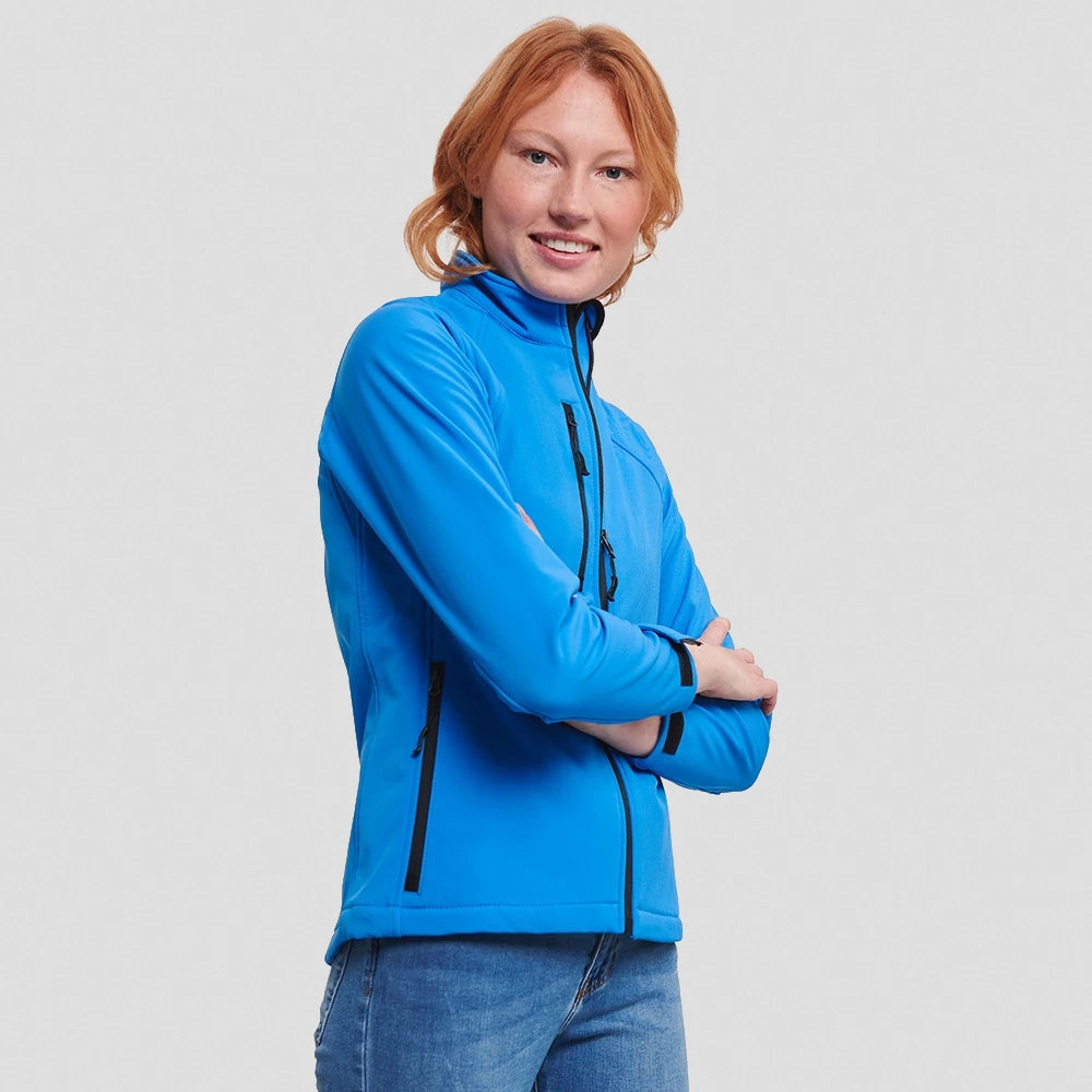 A model wearing a Russell Ladies Soft Shell Jacket