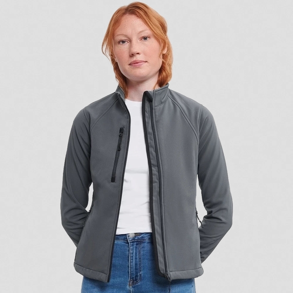 A model wearing a Titanium Russell Ladies Soft Shell Jacket
