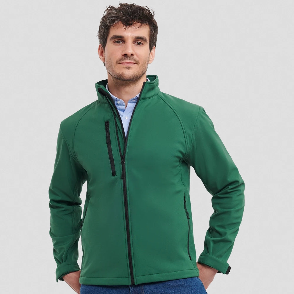 A model wearing a green Russell Soft Shell Jacket