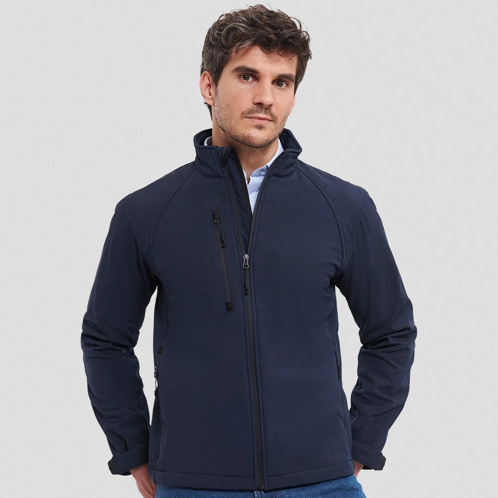 A model wearing a navy Russell Soft Shell Jacket
