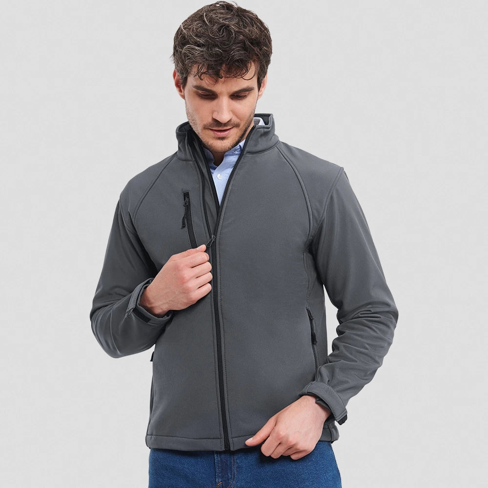 A model wearing a grey Russell Soft Shell Jacket