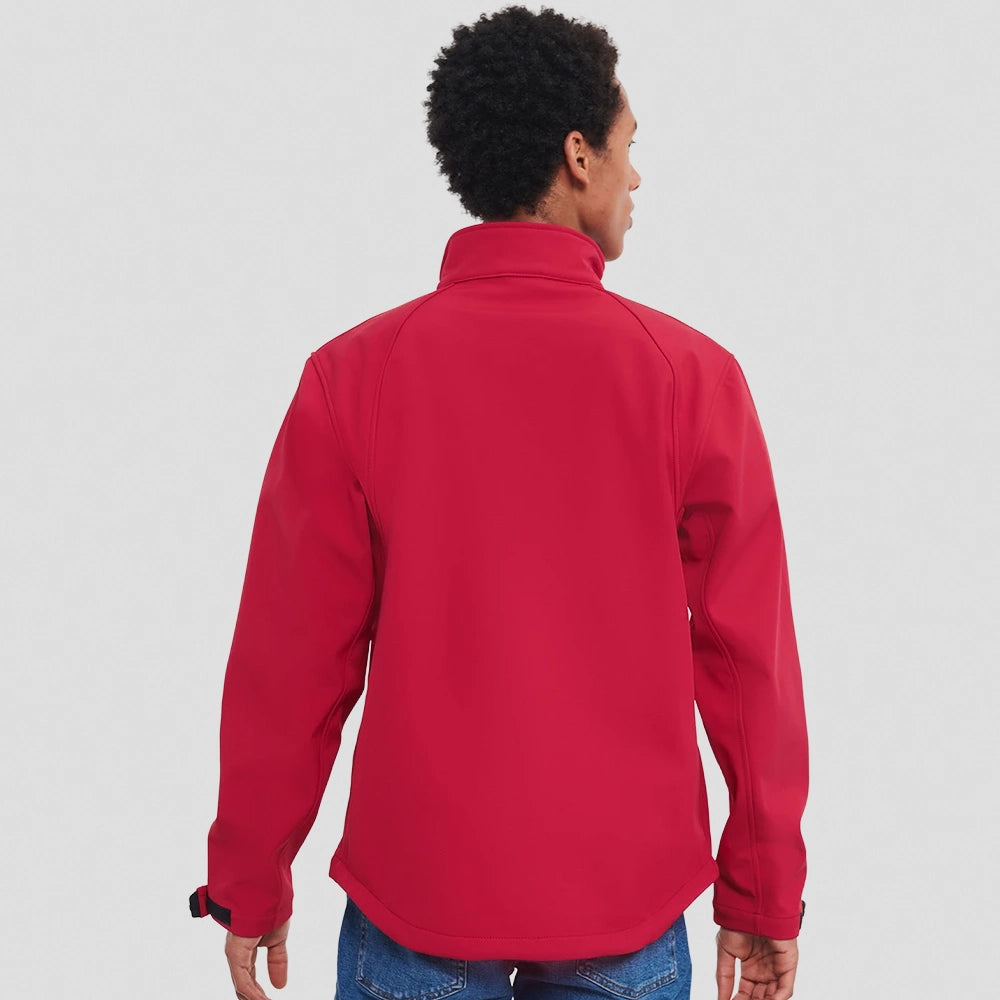 A model wearing a red Russell Soft Shell Jacket