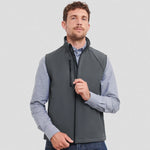 Model wearing a grey Russell Soft Shell Gilet