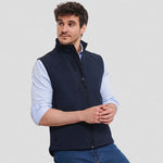 Model wearing a navy Russell Soft Shell Gilet