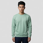 model wearing Authentic Sweatshirt (Colours) in eucalyptus green