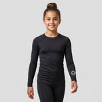 junior model wearing Appleton Netball Club Baselayer – Junior