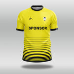 Yellow football shirt with black accents and 'SPONSOR' text on a gray background