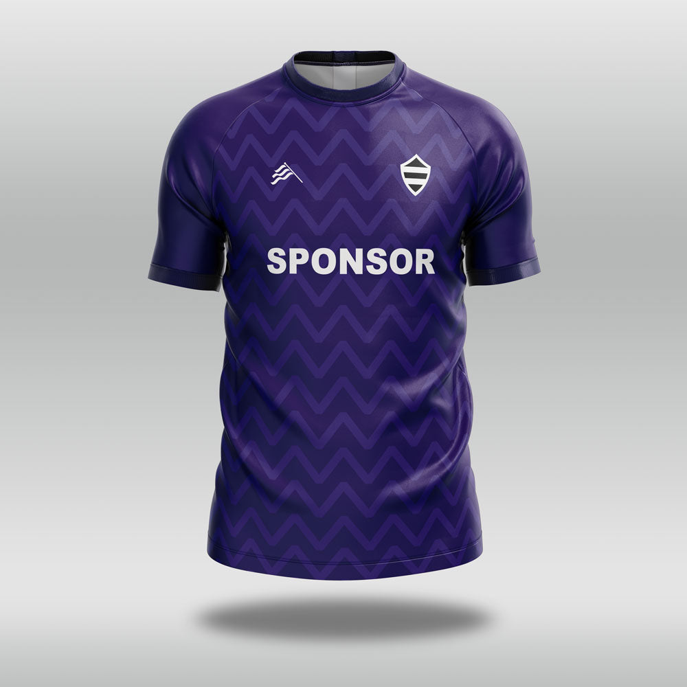 Purple football shirt with a zigzag pattern and 'SPONSOR' text on a gray background