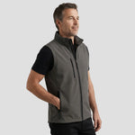 Model wearing the Orn Lapwing Softshell Gilet in Graphite Grey