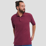 Model wearing the Russell Poly/Cotton Piqué Polo Shirt (Colours) 539M in Burgundy