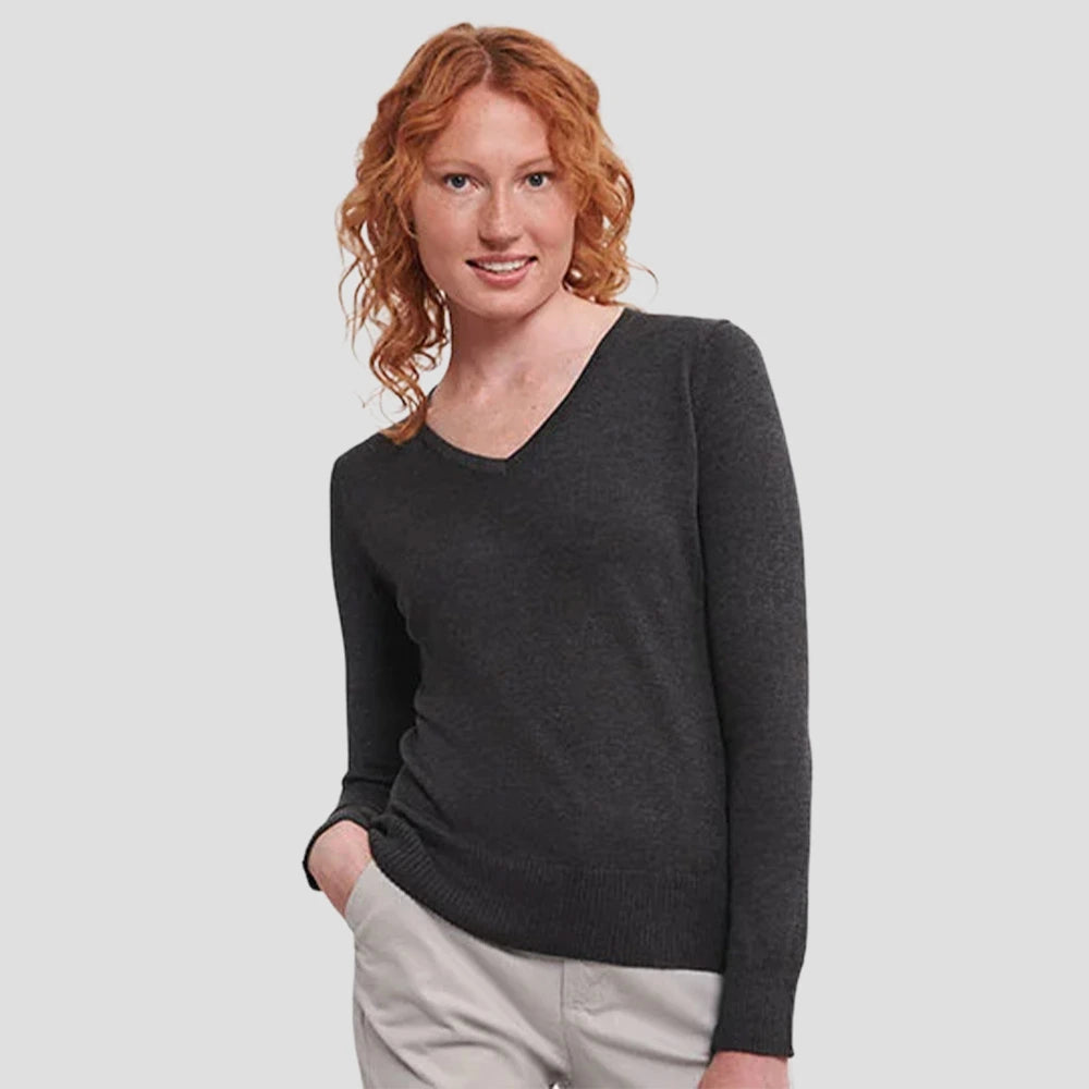 Model wearing the Russell Collection Ladies Cotton Acrylic V Neck Sweater 710F in Charcoal Marl