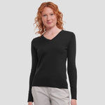 Model wearing the Russell Collection Ladies Cotton Acrylic V Neck Sweater 710F in Black