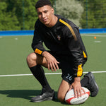 model wearing Edge Pro Contact Top in black/amber