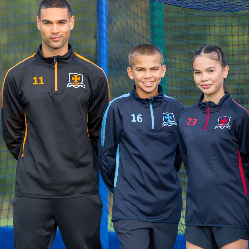 Three individuals wearing the Edge sports midlayers with numbers and logos