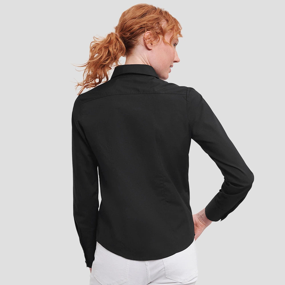 Rear view of Model wearing the Russell Collection Ladies Long Sleeve Fitted Poplin Shirt 924F in Black