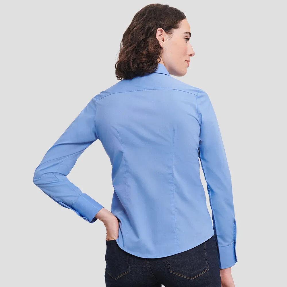 Rear view of Model wearing the Russell Collection Ladies Long Sleeve Fitted Poplin Shirt 924F in Corporate Blue
