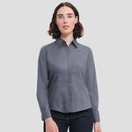 Model wearing the Russell Collection Ladies Long Sleeve Fitted Poplin Shirt 924F in Convoy Grey