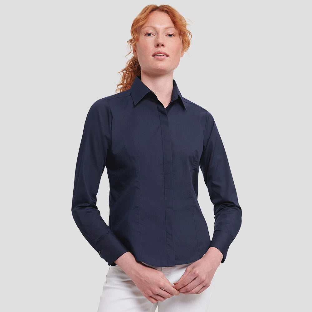 Model wearing the Russell Collection Ladies Long Sleeve Fitted Poplin Shirt 924F in French Navy