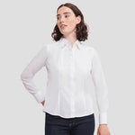 Model wearing the Russell Collection Ladies Long Sleeve Fitted Poplin Shirt 924F in White