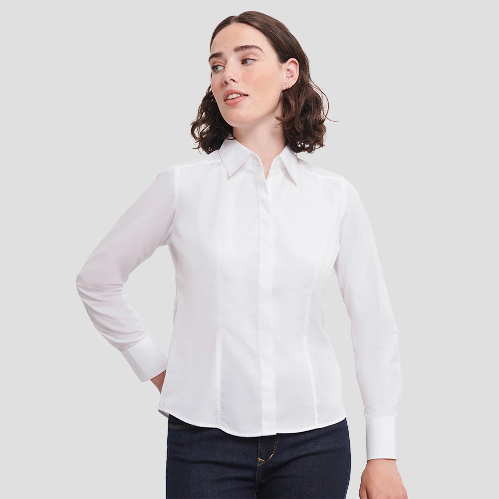 Model wearing the Russell Collection Ladies Long Sleeve Fitted Poplin Shirt 924F in White