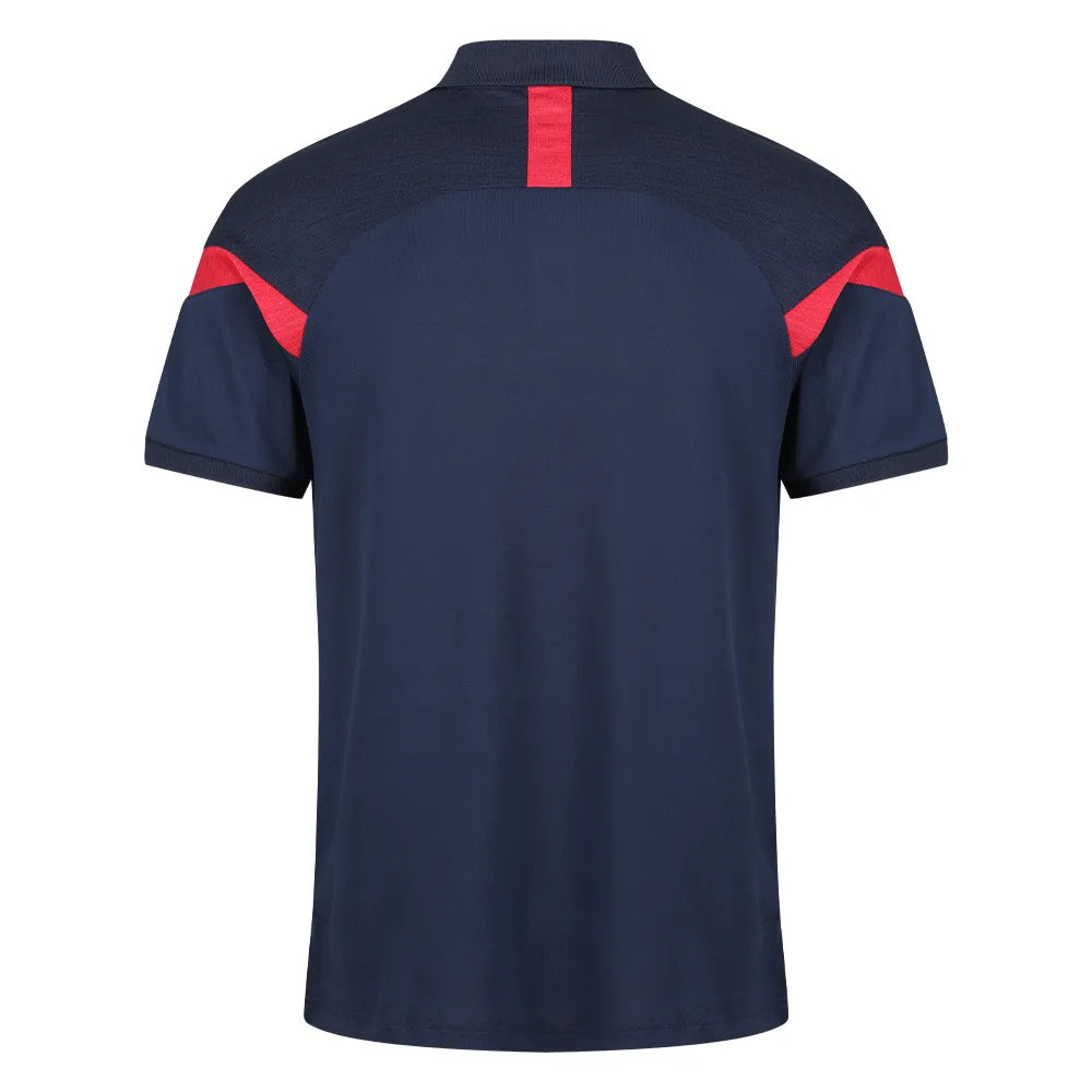 back view of  Kinetic Sports Tech Polo Navy red