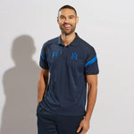 model wearing Kinetic Sports Tech Polo Navy Royal