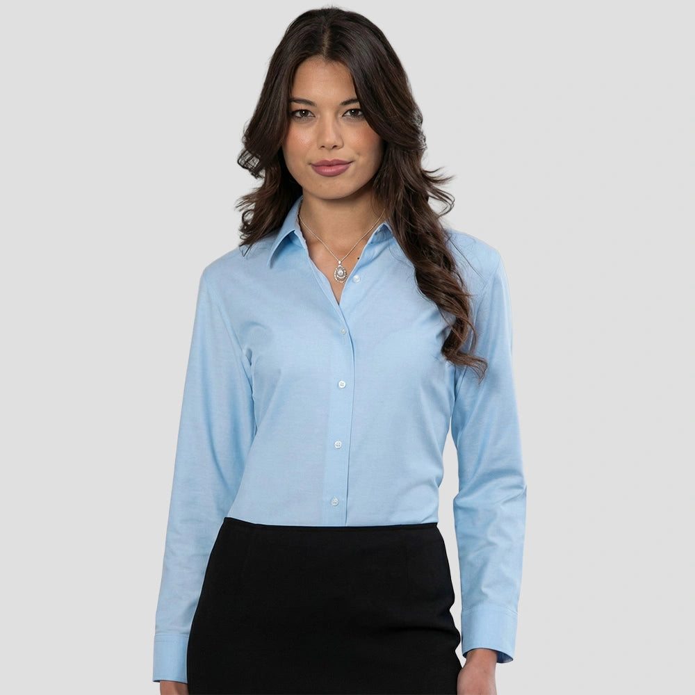 Model wearing the Russell Collection Ladies Long Sleeve Easy Care Oxford Shirt 932f in Oxford Blue