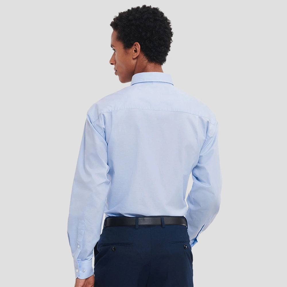 Back view of Model wearing the Russell Collection Long Sleeve Easy Care Oxford Shirt 932M in Oxford Blue