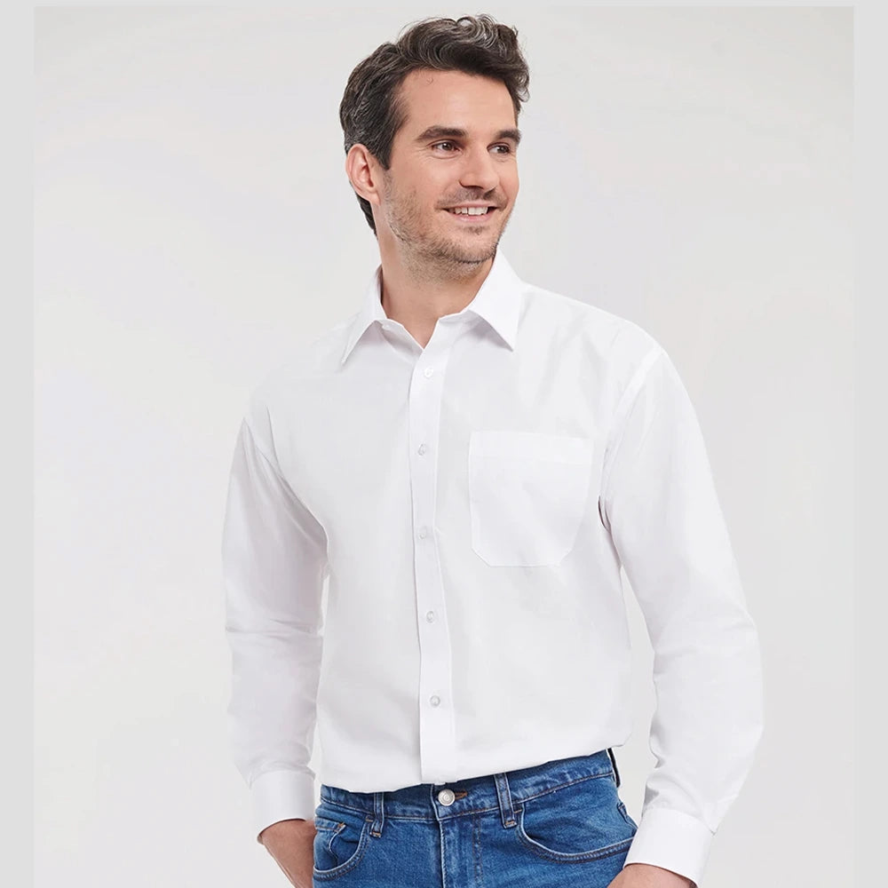 Model wearing the Russell Collection Long Sleeve Easy Care Poplin Shirt 934M in white