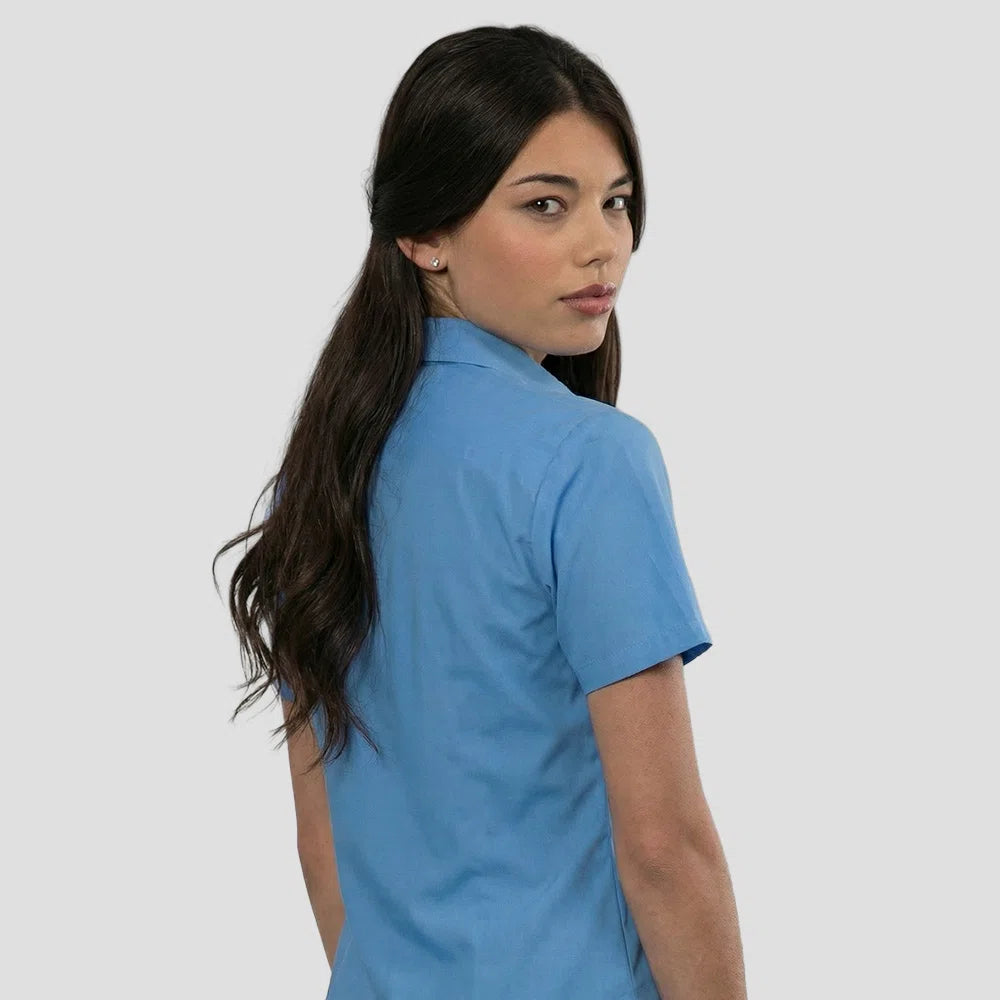 Rear view of model wearing the Russell Collection Ladies Short Sleeve Easy Care Poplin Shirt 935F in Corporate Blue