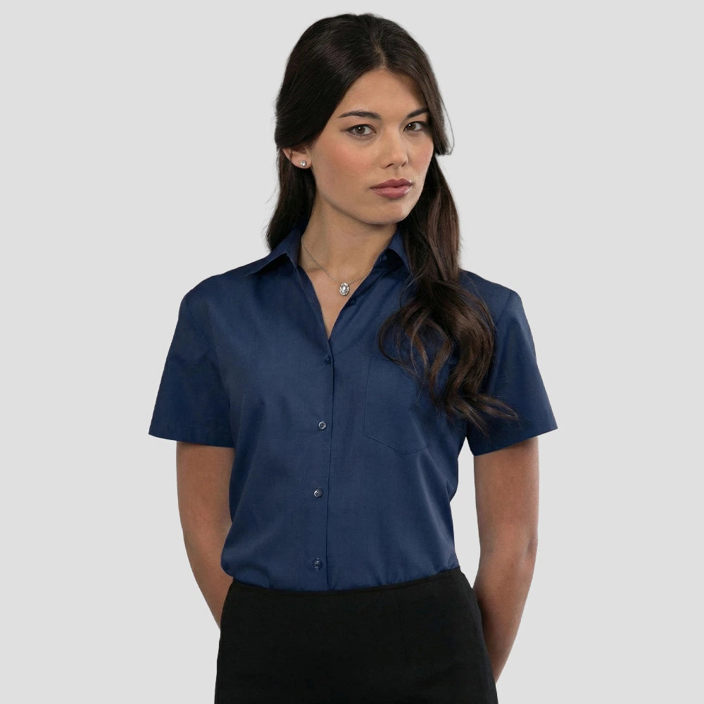 Model wearing the Russell Collection Ladies Short Sleeve Easy Care Poplin Shirt 935F in French Navy