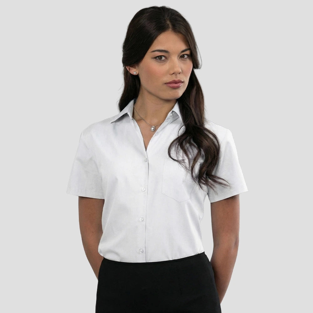 Model wearing the Russell Collection Ladies Short Sleeve Easy Care Poplin Shirt 935F in White