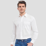 Model wearing the Russell Collection Long Sleeve Easy Care Cotton Poplin Shirt 936M in white