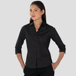 Model wearing the Russell Collection Ladies 3/4 Sleeve Easy Care Fitted Shirt in Black