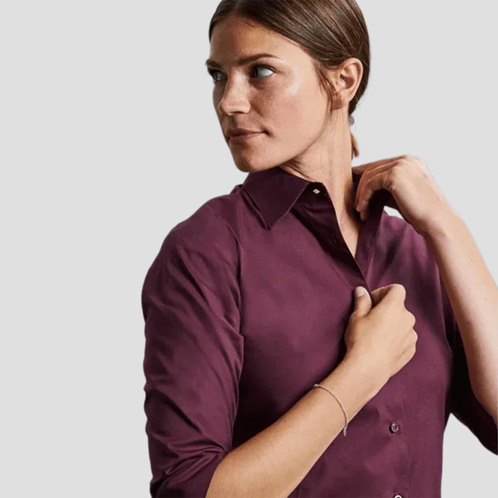 Model wearing the Russell Collection Ladies 3/4 Sleeve Easy Care Fitted Shirt in Port