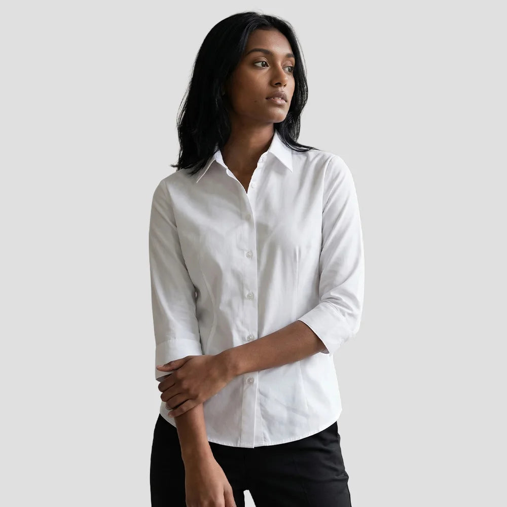 Model wearing the Ladies' 3/4 Sleeve Poly Cotton Easy Care Fitted Polin Shirt in white