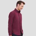 Side view of Model wearing the Russell Collection Long Sleeve Easy Care Fitted Shirt 946M in Port