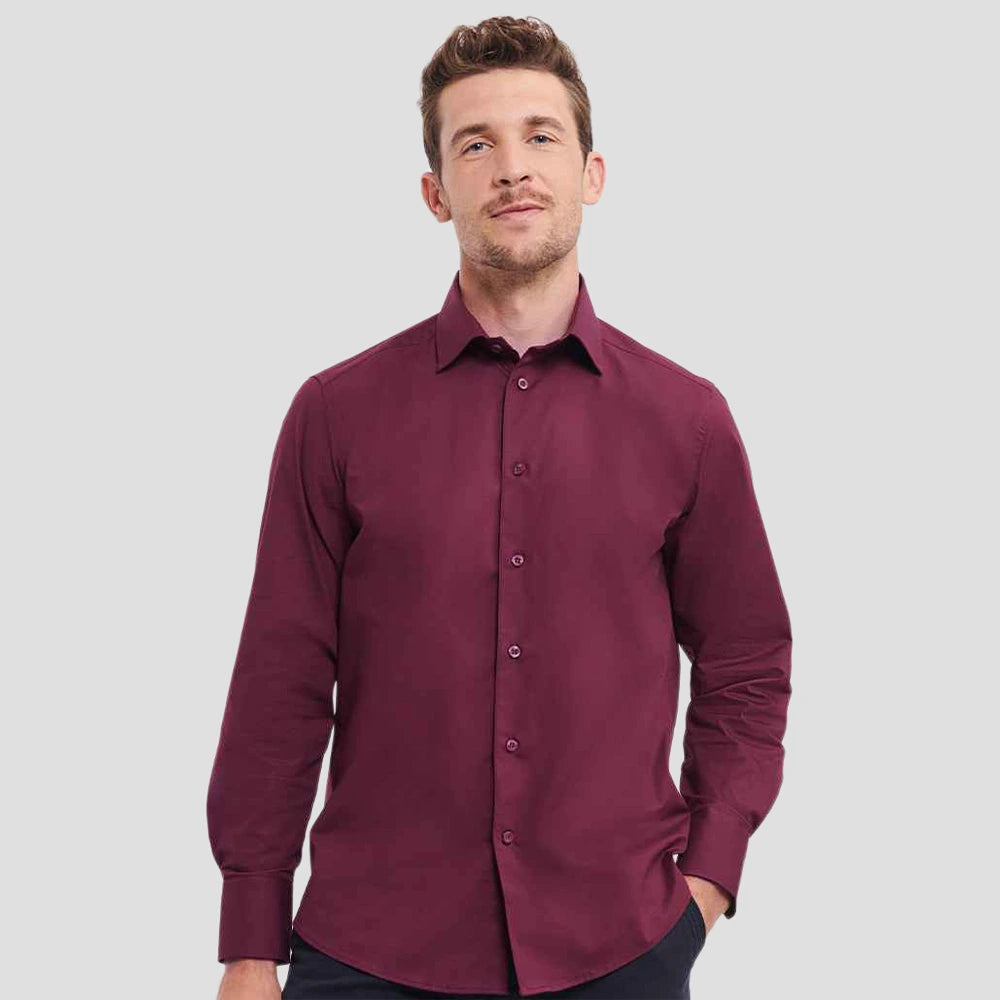 Model wearing the Russell Collection Long Sleeve Easy Care Fitted Shirt 946M in Port