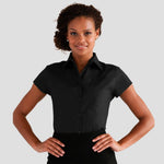 Model wearing the Russell Collection Ladies Short Sleeve Easy Care Fitted Shirt 947F in Black
