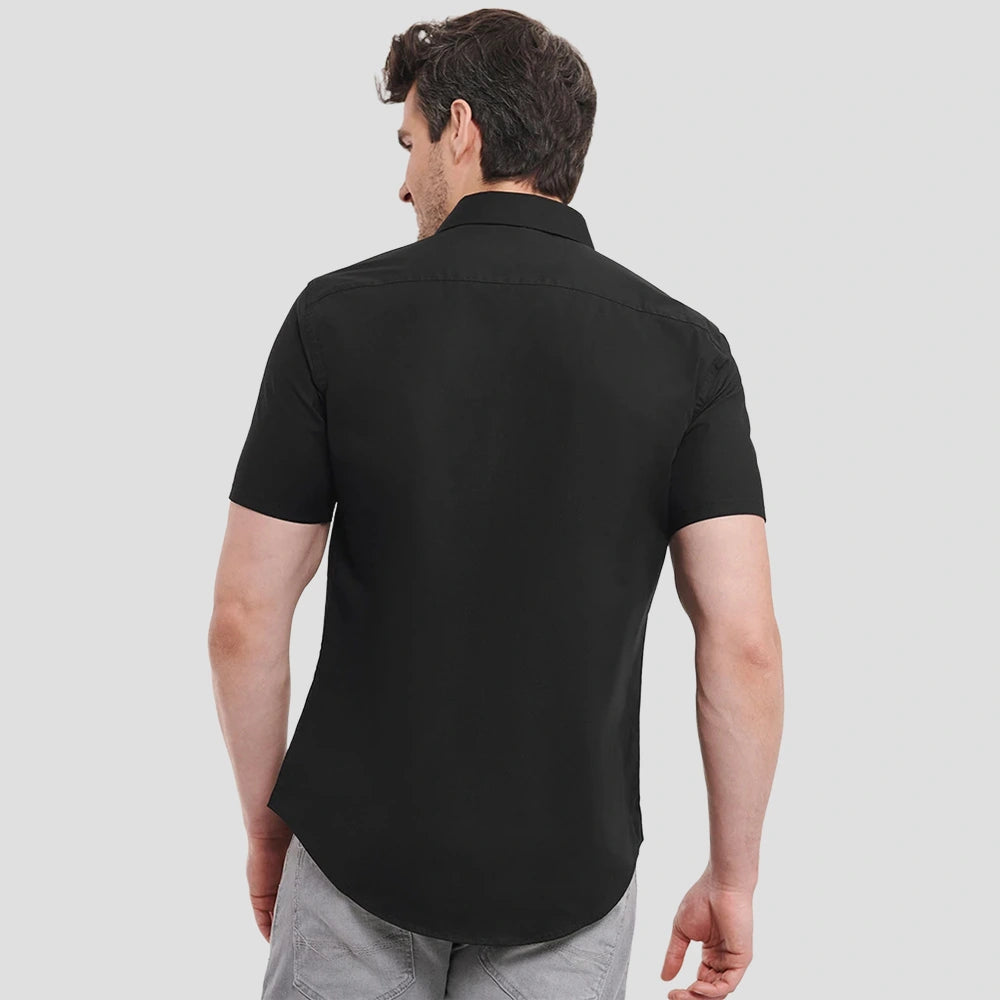 Rear view of Model wearing the Russell Collection Short Sleeve Easy Care Fitted Shirt 947M in Black