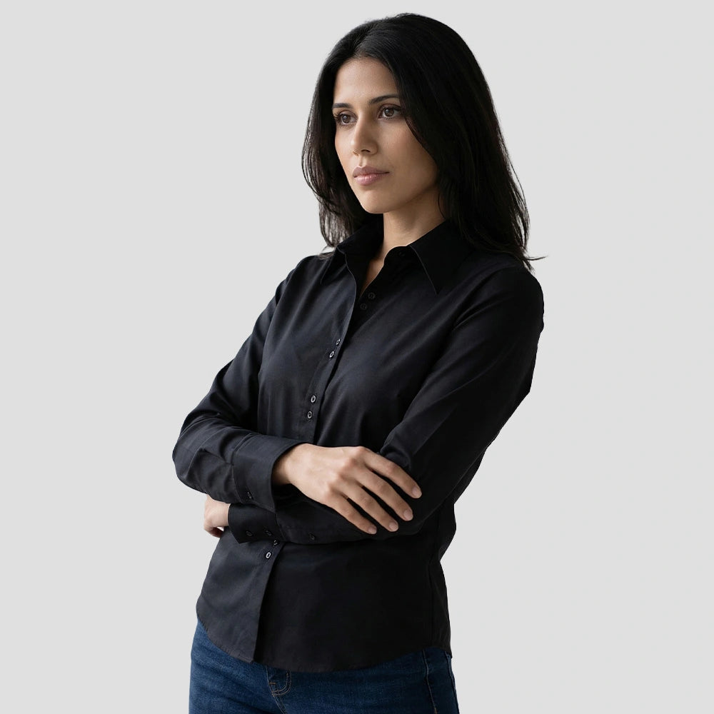 Model wearing the Russell Collection Ladies Long Sleeve Ultimate Non-Iron Shirt in Black
