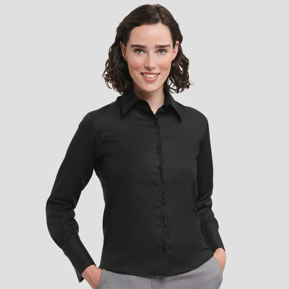 Model wearing the Russell Collection Ladies Long Sleeve Ultimate Non-Iron Shirt in Black