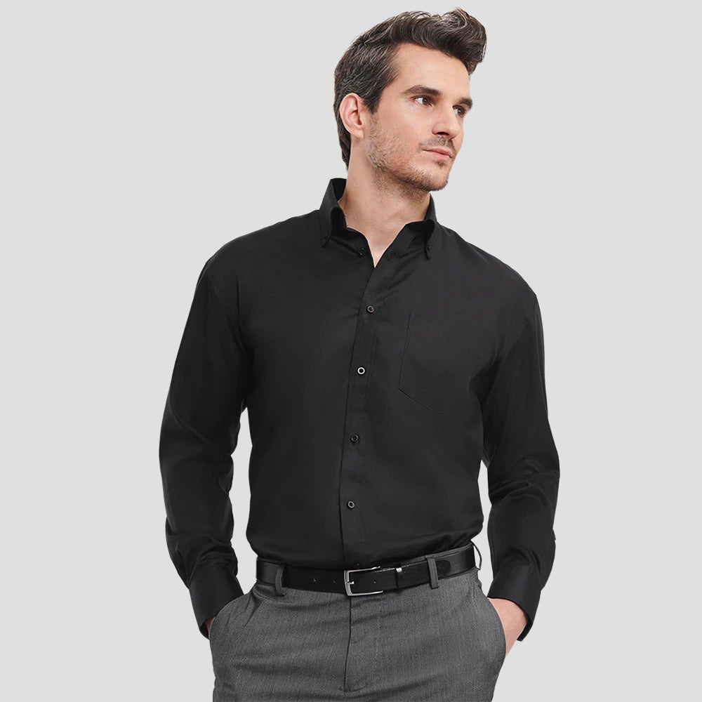 Model wearing the Russell Collection Long Sleeve Ultimate Non-Iron Shirt 956M in Black