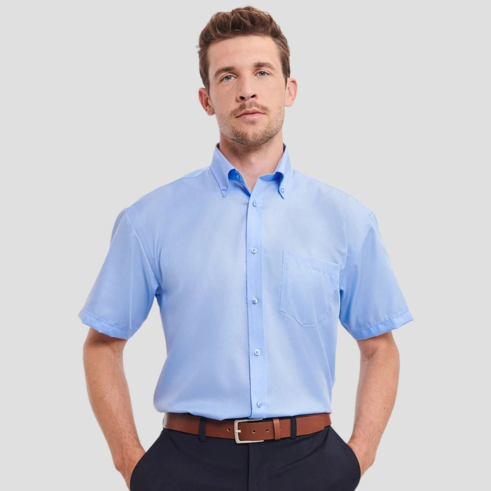 Model wearing the Russell Collection Short Sleeve Ultimate Non-Iron Shirt 957M in Bright Sky Blue